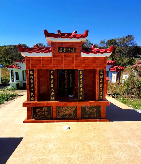 Brick-red Chinese tomb with gold Chinese inscriptions