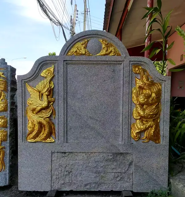 Granite headstone with gold dragon and phoenix