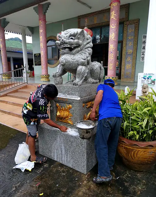Our team installing a stone lion at a shrine