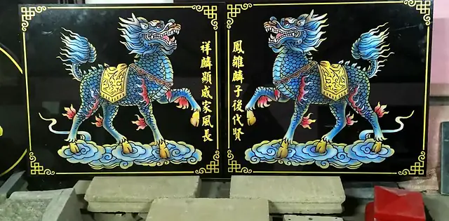 Pair of qilin painted stone plaques