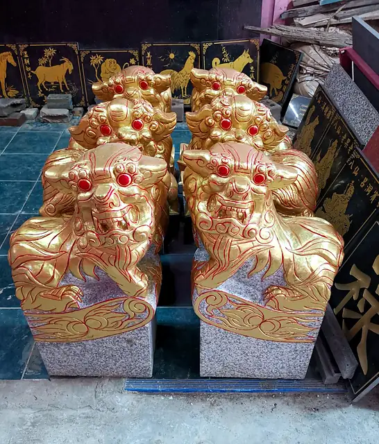 Set of gold-painted stone lions