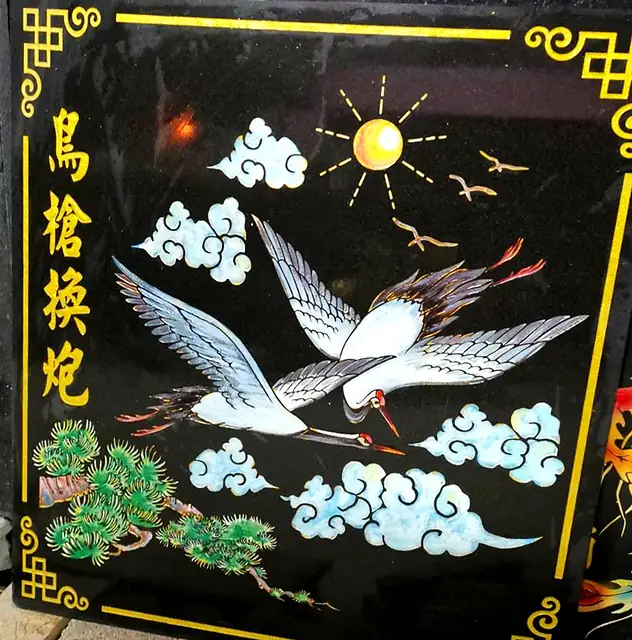 Two cranes and clouds painted stone plaque